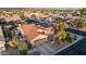 An aerial view of a beautiful home featuring solar panels, a well-manicured yard, and a spacious driveway at 4029 N 160Th Dr, Goodyear, AZ 85395