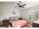 Inviting bedroom with a ceiling fan and decorative accents, providing a cozy and personalized space at 4029 N 160Th Dr, Goodyear, AZ 85395