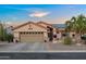 Charming single-story home featuring a two-car garage and desert landscaping at 4029 N 160Th Dr, Goodyear, AZ 85395
