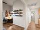 Hallway leading to an office and bathroom with photos decorating the walls at 4029 N 160Th Dr, Goodyear, AZ 85395