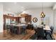 Kitchen with a large center island, dark wood cabinets, and stainless steel appliances at 4029 N 160Th Dr, Goodyear, AZ 85395