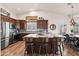 A stylish kitchen with a large island, granite countertops, and stainless steel appliances at 4029 N 160Th Dr, Goodyear, AZ 85395