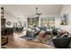 Open-concept living room with hardwood floors and natural light at 4029 N 160Th Dr, Goodyear, AZ 85395