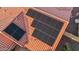A close-up aerial view showcasing solar panels installed on a terracotta tile roof at 4029 N 160Th Dr, Goodyear, AZ 85395