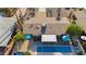 Aerial back view of home featuring a backyard pool, patios, landscaping, and mature trees at 421 N Evergreen St, Chandler, AZ 85225