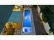 Aerial view of the backyard, highlighting the modern pool, patio, and lush landscaping creating a private oasis at 421 N Evergreen St, Chandler, AZ 85225