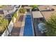 Birds eye view of backyard featuring sparkling pool, landscaping, covered patio and detached office at 421 N Evergreen St, Chandler, AZ 85225