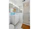 Bathroom with a modern vanity, mirrored cabinets, and a glass-enclosed shower at 421 N Evergreen St, Chandler, AZ 85225