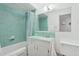 Cozy bathroom with a shower-tub combination, a vanity, and mint green tile at 421 N Evergreen St, Chandler, AZ 85225