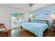 Cozy bedroom with a calming color scheme, a ceiling fan, and natural light at 421 N Evergreen St, Chandler, AZ 85225