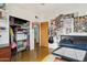 Functional bedroom with open closet, personal decor, and comfortable bed at 421 N Evergreen St, Chandler, AZ 85225