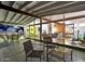 Relaxing covered patio area with ample seating and seamless transition to the home's interior through large glass windows at 421 N Evergreen St, Chandler, AZ 85225