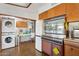 Charming kitchen with vintage appliances, including a washer/dryer and built-in oven at 421 N Evergreen St, Chandler, AZ 85225