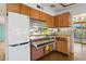 Well-equipped kitchen featuring retro appliances, plenty of cabinet space, and a cozy design at 421 N Evergreen St, Chandler, AZ 85225