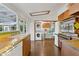 Spacious kitchen with vintage cabinetry, a sink, and modern laundry machines at 421 N Evergreen St, Chandler, AZ 85225