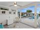 Bright room with glass doors opening to an outdoor pool area with lounge chairs and stylish decor at 421 N Evergreen St, Chandler, AZ 85225