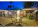 Outdoor patio with comfortable seating, an umbrella table, views of the surrounding landscape, and string lights at night at 421 N Evergreen St, Chandler, AZ 85225