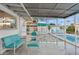 Outdoor screened-in patio next to a pool, with seating, a privacy fence, and an umbrella at 421 N Evergreen St, Chandler, AZ 85225
