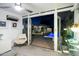 Bright interior view looking out onto backyard, including patio, pool, and outdoor seating, via glass door at 421 N Evergreen St, Chandler, AZ 85225