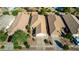 Aerial view of single Gathering homes with private driveways, tile roofs, and desert landscaping at 4251 E Sundance Ave, Gilbert, AZ 85297