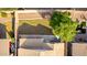 Aerial view of a backyard featuring a small lawn, patio, and air conditioning units at 4251 E Sundance Ave, Gilbert, AZ 85297