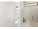 Bright bathroom featuring a shower-tub combo, toilet, and a neutral color scheme at 4251 E Sundance Ave, Gilbert, AZ 85297
