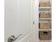 Organized closet showcasing woven baskets on shelves, creating a tidy storage space at 4251 E Sundance Ave, Gilbert, AZ 85297