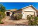 Inviting single-story home showcasing a well-manicured front yard and a two-car garage at 4251 E Sundance Ave, Gilbert, AZ 85297