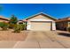 Single-story home with a two-car garage and desert landscaping providing curb appeal at 4251 E Sundance Ave, Gilbert, AZ 85297
