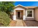 Charming front porch with decorative pillars and desert landscaping at 4251 E Sundance Ave, Gilbert, AZ 85297