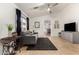 Inviting living room featuring tile flooring, a comfortable sofa, and an open layout at 4251 E Sundance Ave, Gilbert, AZ 85297