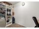 Office space featuring a large bookshelf and a clock on the wall at 4251 E Sundance Ave, Gilbert, AZ 85297