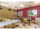 Inviting classroom with tables, chairs, and storage, bathed in natural light for engaging activities at 42711 W Darter Dr, Maricopa, AZ 85138