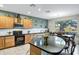 Inviting kitchen with a large island, lots of cabinets, and stainless appliances at 42711 W Darter Dr, Maricopa, AZ 85138