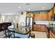 Bright kitchen with stainless steel appliances, granite countertops and a tiled backsplash at 42711 W Darter Dr, Maricopa, AZ 85138