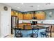 Beautiful kitchen with stainless steel appliances, black countertops, and lots of cabinet space at 42711 W Darter Dr, Maricopa, AZ 85138
