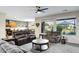 Bright living room with views to the outside, showcasing the flow of the living space at 42711 W Darter Dr, Maricopa, AZ 85138