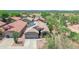 Aerial view of a well-maintained property with solar panels, mature landscaping, and a desert backdrop at 4301 E Abraham Ln, Phoenix, AZ 85050