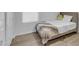 Bright bedroom showcasing wood floors, a soft bed, a window and a plush throw blanket at 4301 E Abraham Ln, Phoenix, AZ 85050