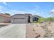 Charming single-story home with a neutral color scheme, two-car garage and well-maintained desert landscaping at 4301 E Abraham Ln, Phoenix, AZ 85050