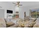 Bright living room featuring a cozy fireplace, comfortable seating, and large windows offering great natural light at 4301 E Abraham Ln, Phoenix, AZ 85050