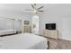 Spacious bedroom featuring a ceiling fan, ensuite bathroom, closet, and a light and airy feel at 4301 E Abraham Ln, Phoenix, AZ 85050