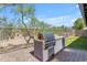 Contemporary outdoor kitchen features a high-end grill and ample counter space at 4301 E Abraham Ln, Phoenix, AZ 85050