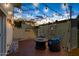 Cozy backyard patio with string lights, perfect for relaxing and entertaining in the evening at 4629 S Mill Ave, Tempe, AZ 85282