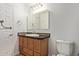 Bathroom featuring a single sink vanity, medicine cabinet, and toilet at 4629 S Mill Ave, Tempe, AZ 85282