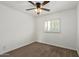 Bedroom featuring plush carpet, ceiling fan, and a window at 4629 S Mill Ave, Tempe, AZ 85282