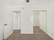 Bedroom featuring plush carpet, closet, and an entry doorway at 4629 S Mill Ave, Tempe, AZ 85282