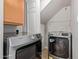 Laundry room featuring gray washer and dryer with storage cabinet at 4629 S Mill Ave, Tempe, AZ 85282