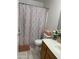 Bathroom with a decorative shower curtain and fresh towels at 4743 W Alice Ave, Glendale, AZ 85302