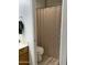 Bathroom with neutral-toned shower curtain at 4743 W Alice Ave, Glendale, AZ 85302